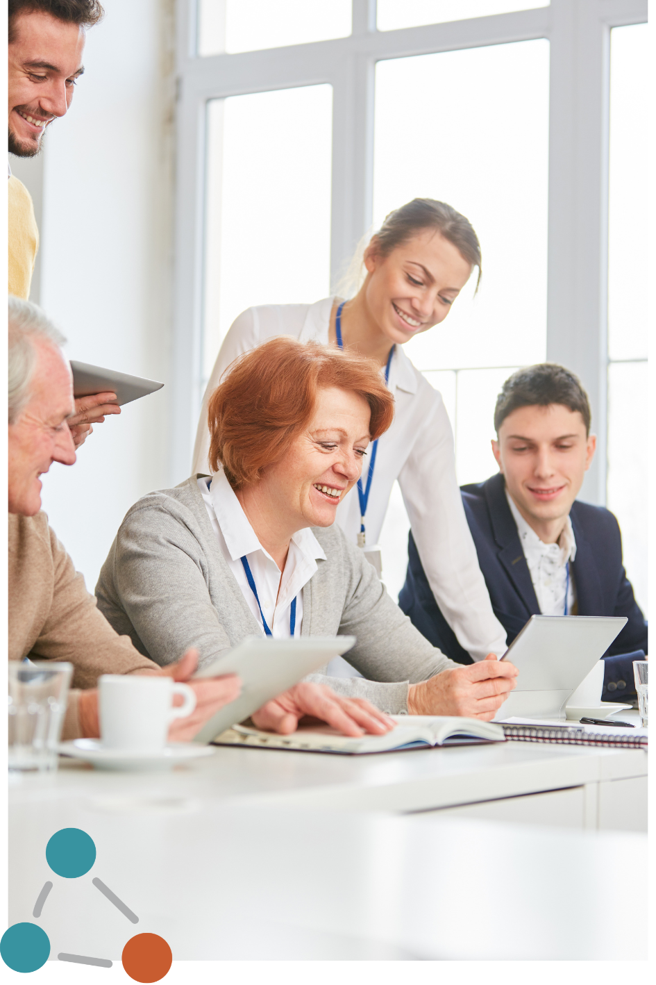 People sitting around a computer